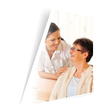 caregiver and patient smiling towards each other